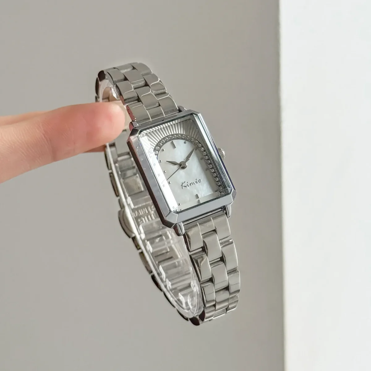 Side view of vintage silver rectangular women’s watch with white dial – WatchTrio