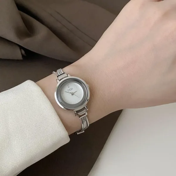Vintage silver watch on wrist, 24mm dial, quartz movement, 30m water resistant ladies’ wristwatch