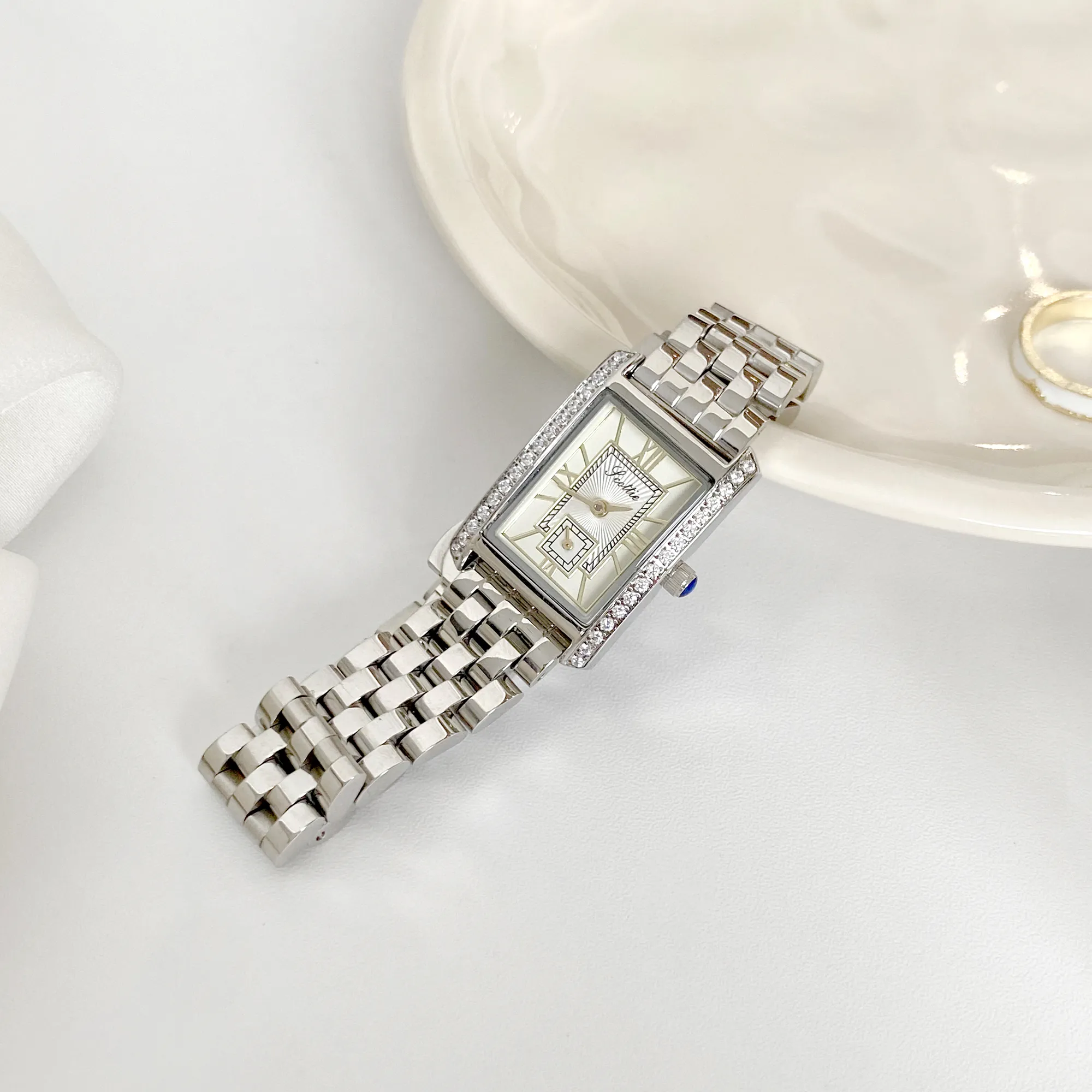 Vintage silver strap women’s watch with rectangular white dial displayed – WatchTrio