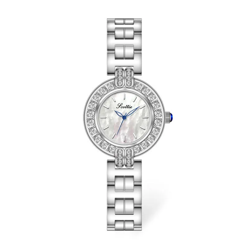 Vintage silver women’s watch with round crystal bezel and white dial on display – WatchTrio