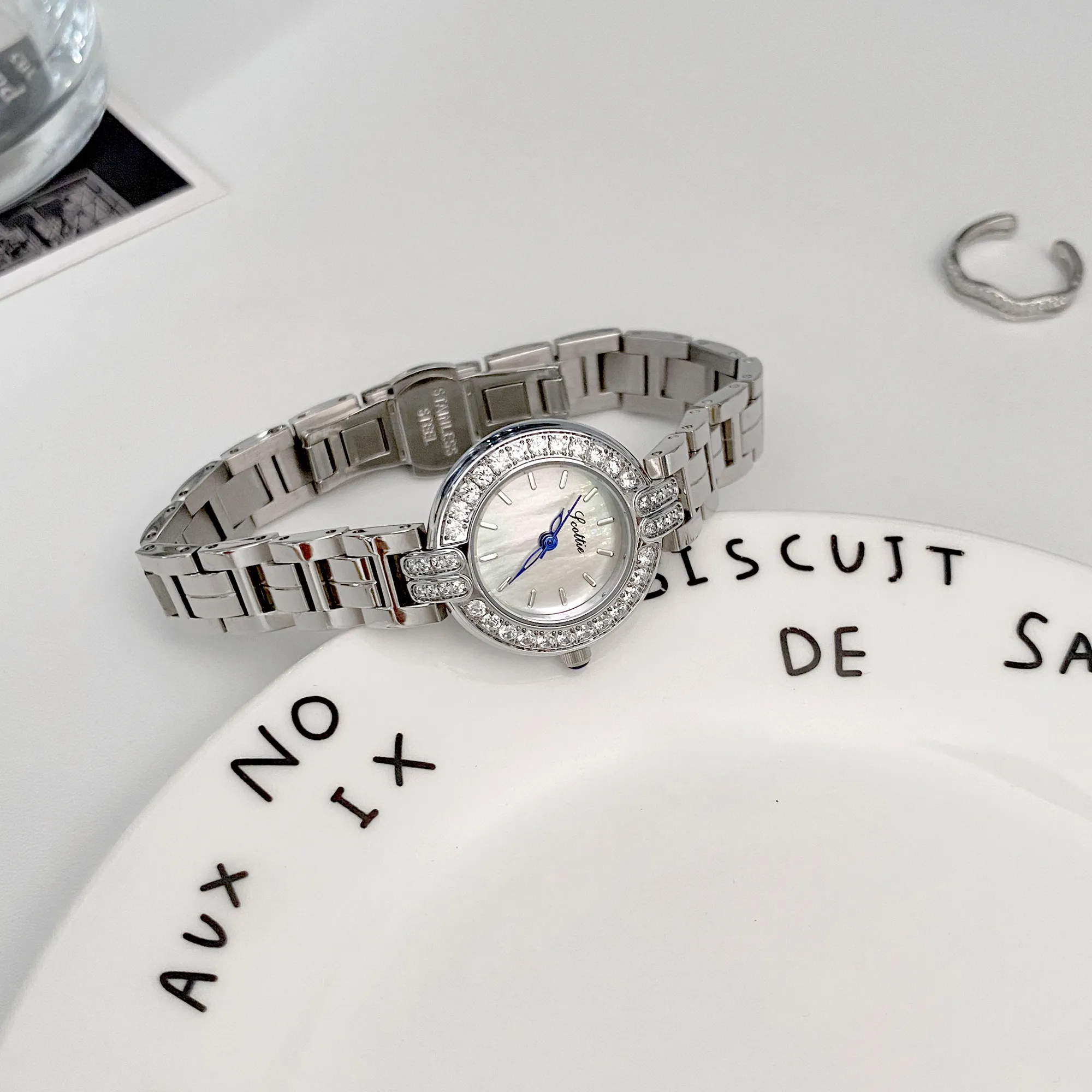 Studio shot of vintage silver women’s watch with crystal bezel and classic round dial – WatchTrio