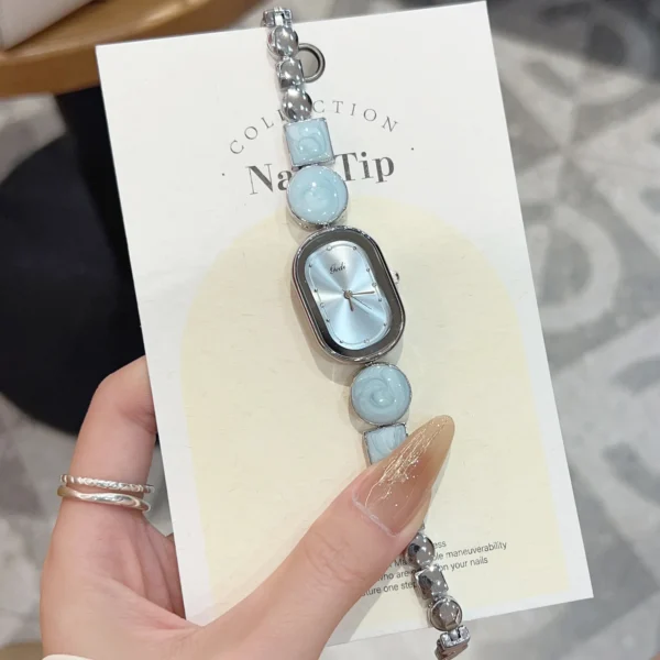 Vintage women’s silver irregular bracelet watch with blue dial – WatchTrio