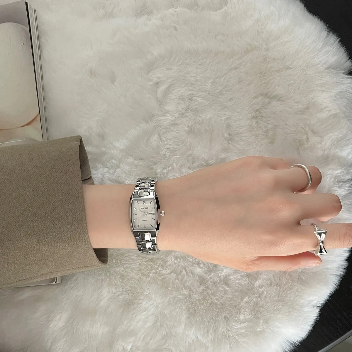 Vintage women’s silver retro watch with black dial and stainless steel strap