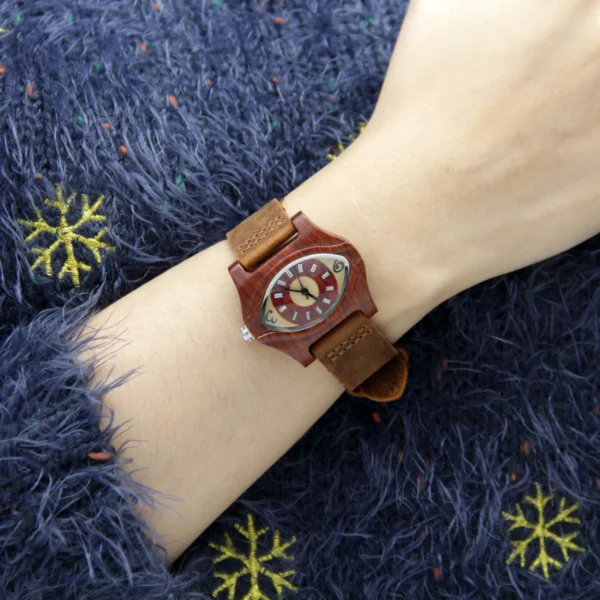 Vintage wooden eye women’s watch with brown strap shown on hand – WatchTrio