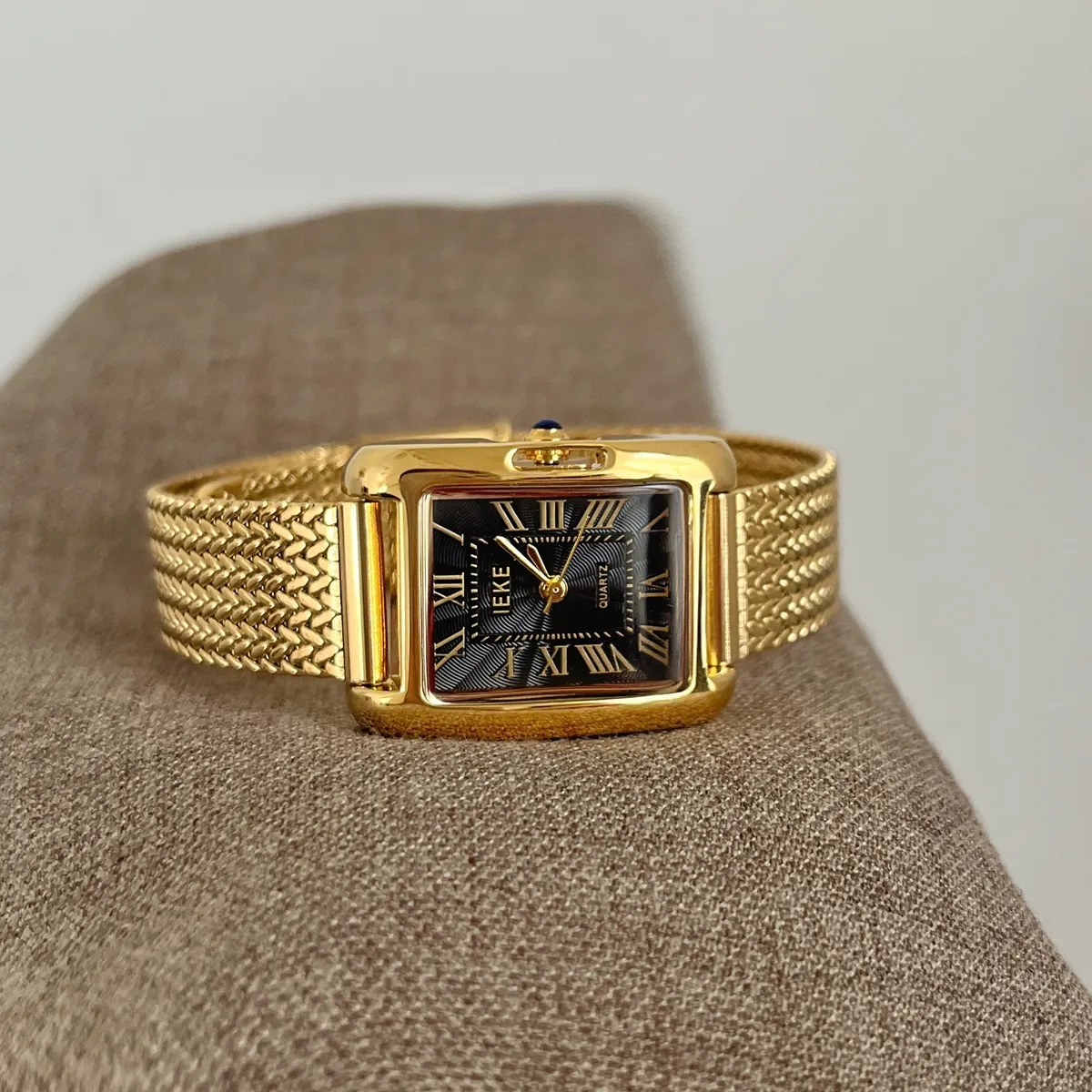 Vintage gold ladies watch with black dial and mesh strap