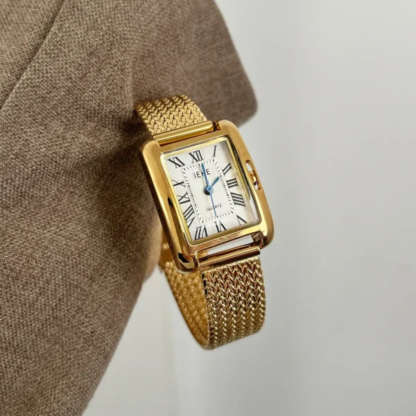 Vintage gold ladies watch with white dial and mesh strap