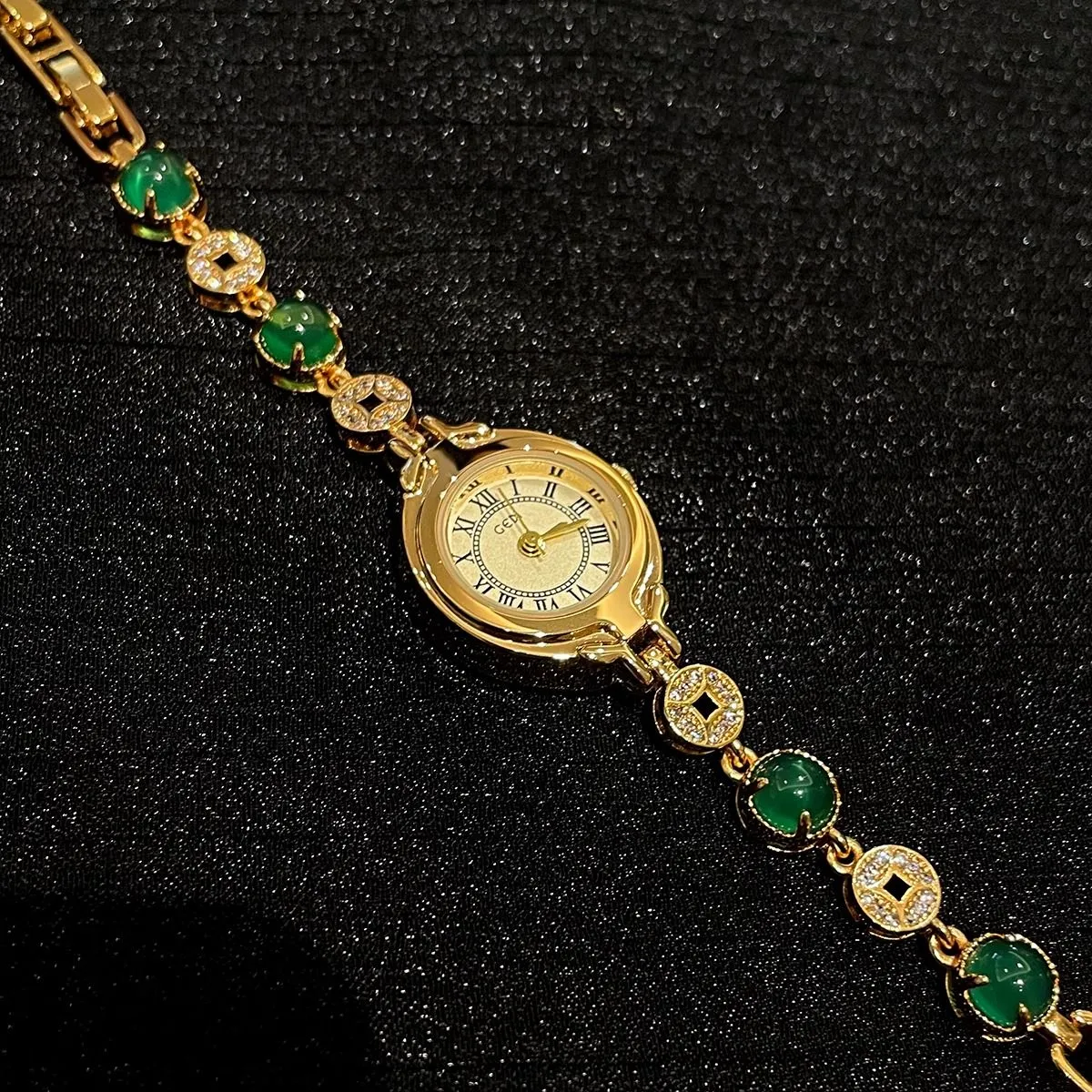 Classic vintage gold bracelet women’s watch with jade stones on black background – WatchTrio