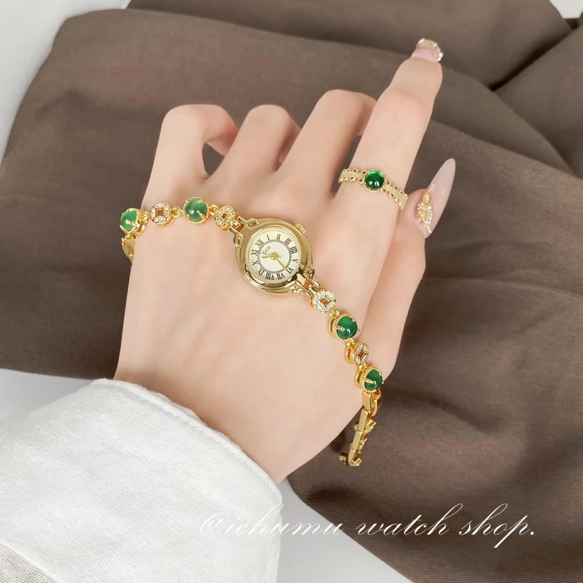 Vintage gold women’s bracelet watch with jade stones worn on wrist – WatchTrio