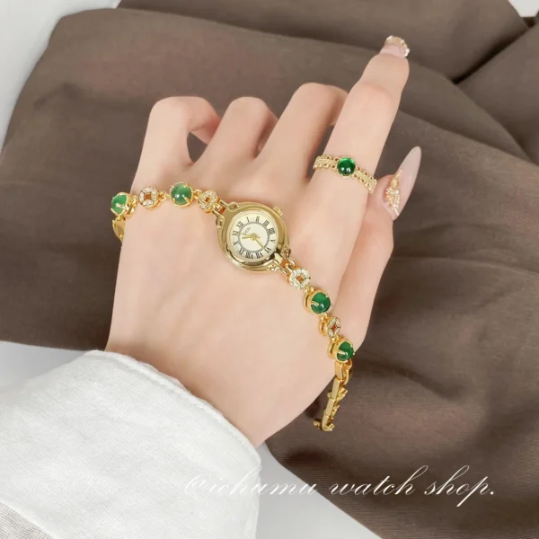 Vintage gold women’s bracelet watch with jade stones worn on wrist – WatchTrio