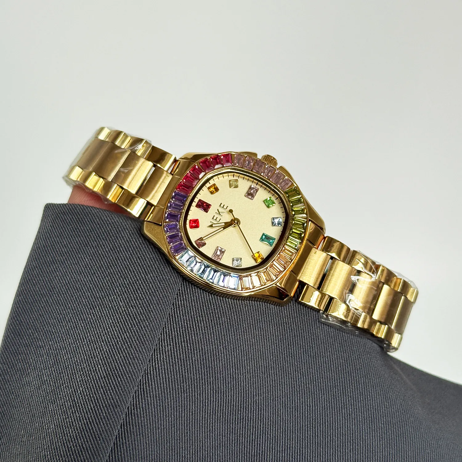 vintage gold women’s watch with rainbow bezel and gold dial
