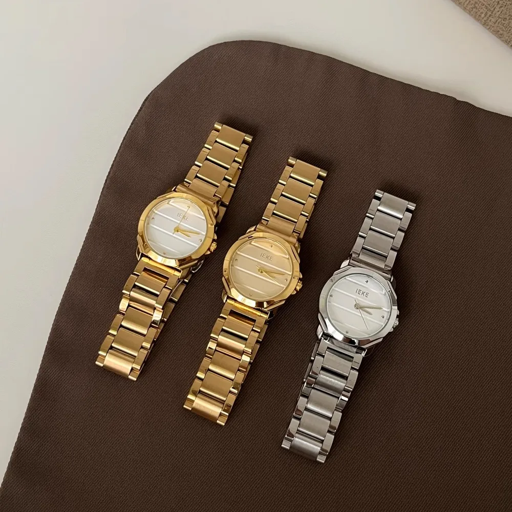Three vintage women’s watches in gold and silver metal straps