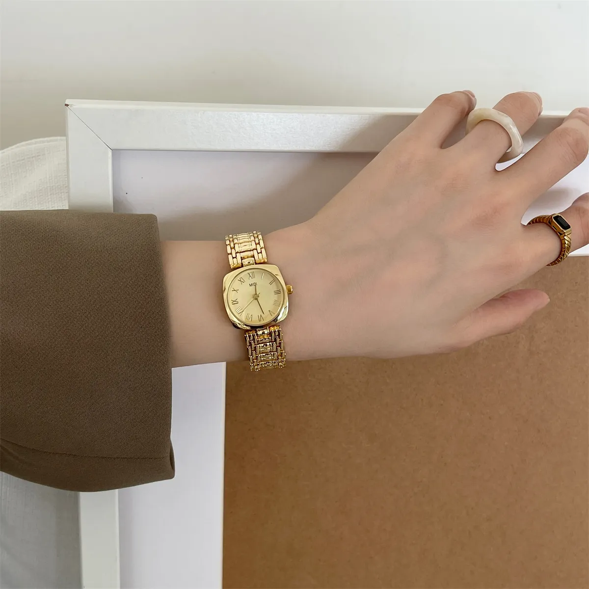 Gold vintage womens square watch worn on wrist