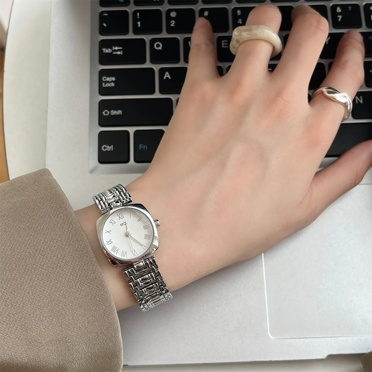 Silver square vintage womens watch being worn