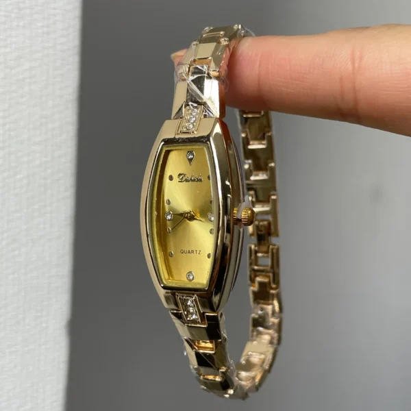 Women’s gold bracelet quartz watch with tonneau case