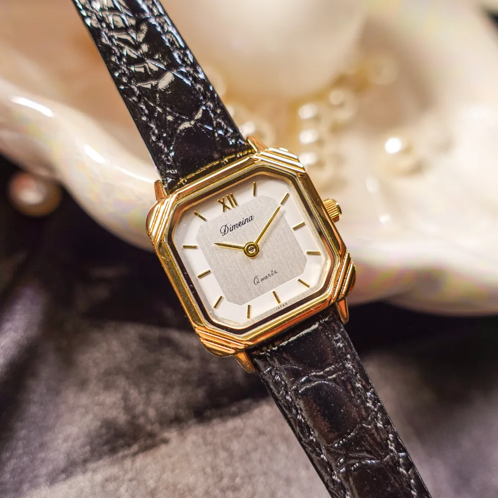 Women’s vintage square quartz watch with black strap and gold case