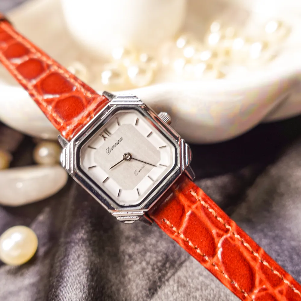 Women’s vintage square quartz watch with black strap and silver case